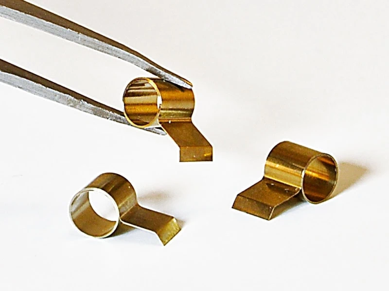 Constant Force Springs Three constant force springs designed for brush motor attachments, highlighting their role in maintaining consistent electrical contact. Powering performance—constant force springs in brush motor applications ensure reliable electrical contact for smooth and efficient operation.