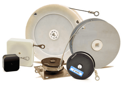 Group of Spring Reels encased in various materials. Spring reels offer constant force uniformly distributed for counterbalancing loads from under one pound to over 50 pounds.